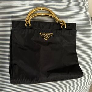 Prada black nylon bag with gold handles